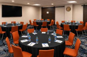 a conference room with tables and chairs with water bottles on them at Holiday Inn Express Wixom by IHG in Wixom +67 photos
