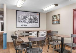 a restaurant with tables and chairs in a room at Super 8 by Wyndham Perham in Perham