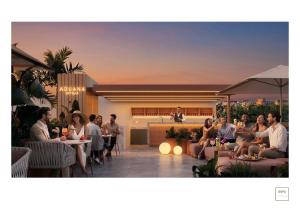 a group of people sitting on a patio at Aduana Suites in Salou