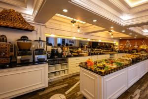 a restaurant with a buffet of food on display at Andalouse Otel in Trabzon