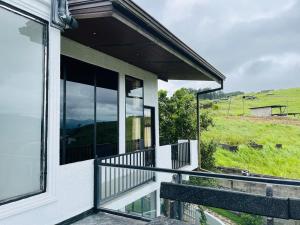 a house with a balcony with a view at N4 Rest Hanthana in Etulgama