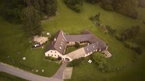 an aerial view of a large house on a green field at Aigen 13 - Dreiviertelhof im Waldviertel in Aigen