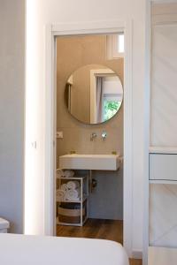 a bathroom with a sink and a mirror at Affittacamere La Nuvola in Chieti +22 photos