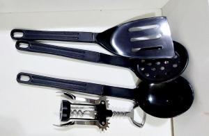 two measuring utensils sitting on top of a knife at Graciosa Reserva Ipanema in Porto Alegre