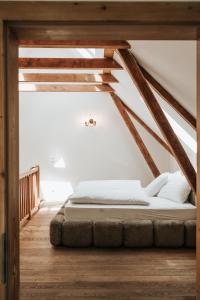 a bed in the middle of a room at ILLYRHof in Gamlitz