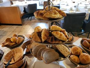 a display of bread and pastries on a table at Landhaus Auhirsch in Böbrach +27 photos