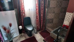 a bathroom with a shower with a toilet and a sink at Annsmuiža in Salacgrīva +27 photos