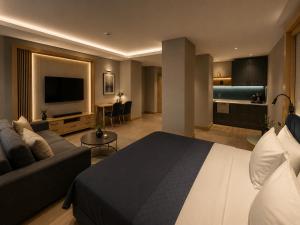 a hotel room with a bed and a couch at Cher Hotel Eyüp in Istanbul