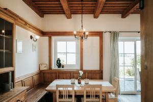 a dining room with a table and chairs at ILLYRHof in Gamlitz