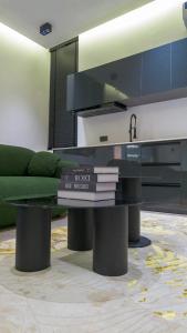 a coffee table with books on top of it at Reign Residence in Port Harcourt +13 photos