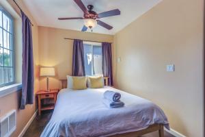 a bedroom with a bed with a ceiling fan at The Nook in Coeur d'Alene