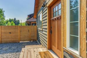 a wooden door to a house with a fence at The Nook in Coeur d'Alene