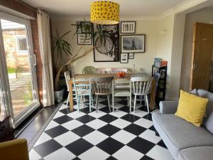 a dining room with a table and chairs at Deighton Lodge in York