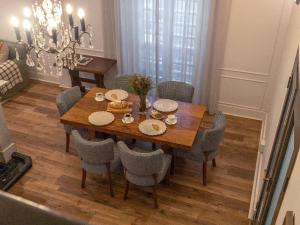 a dining room table with chairs and a dining room at Nomad City Suites in Cape Town