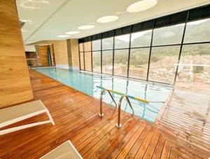 a large swimming pool with a large window at Distrito Prime 1-302 in Bogotá