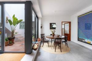 a dining room with a table and chairs at Casa Terraza in La Herradura +23 photos