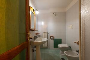 a bathroom with a sink and a toilet at Residenza Lorica in Lorica +45 photos