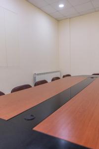a conference room with a long table and chairs at Saint Paul Guesthouse in Zahlé
