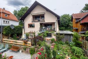 a house with a garden in front of it at Fewo Krick in Bad Soden-Salmünster