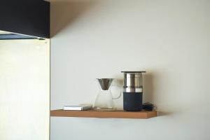 a coffee maker sitting on a wooden shelf at SUISUI Hakushu Hotel in Shirasu