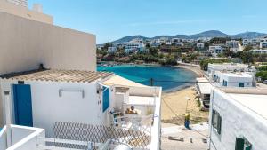 a view of a harbor from a building at Tzivaeriparos studio in Piso Livadi