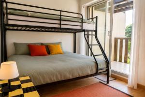 a bedroom with a bunk bed and a window at Pool 3 Balconies & Parking in La Baule