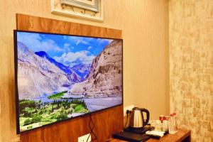 a large flat screen tv hanging on a wall at SkyRidges in Srinagar