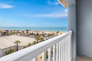 a balcony with a view of the beach at Hyatt Select Galveston Beachfront in Galveston