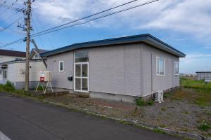 a small house on the side of a street at Seaside Deer Shiraoi in Shiraoi