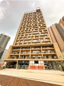 a tall building with many windows in a city at Distrito prime 1-303 in Bogotá
