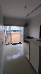 a living room with a view of a beach at Hotel Gramados in Porangatu