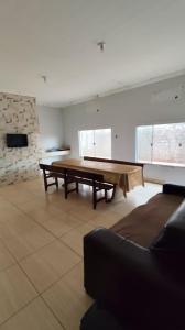 a large room with a ping pong table in it at Hotel Gramados in Porangatu