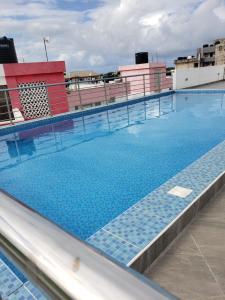 a swimming pool on top of a building at SPACIOUS VIP 1 BEDROOM with ROOFTOP SWIMMING POOL AVAILABLE in Mtwapa
