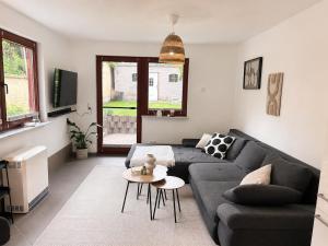 a living room with a couch and a table at Ferienwohnung am Bodden in Barth