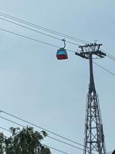 a cable car in the sky with a tower at Sofia's home in Piatra Neamţ