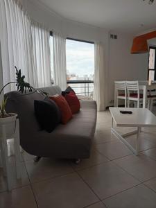 a living room with a couch and a table at Apartamento 4 de Enero in Santa Fe