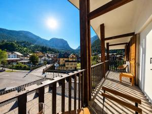 a balcony with a view of the mountains at Hostdomus - Casa Ariel in Cesana Torinese