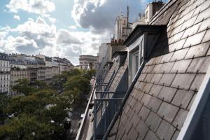 a balcony of a building with a view of a city at ELSA, Hôtel Paris by Collection Vesper in Paris