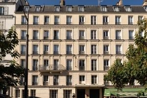 a large white building with a lot of windows at ELSA, Hôtel Paris by Collection Vesper in Paris