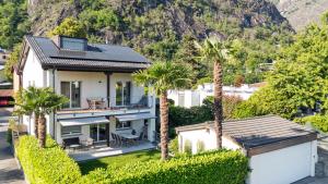 an aerial view of a house with palm trees at Casa QUATTRO FIUMI in Tegna