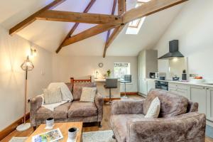 a living room with two chairs and a couch at 1 Bed in Crakehall oc-o30357 in Crakehall