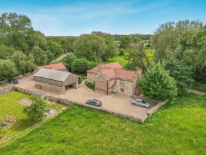an overhead view of a house with two cars parked at 1 Bed in Crakehall oc-o30357 in Crakehall