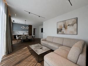 a living room with a couch and a table at Beachfront Luxury Villa - Bar in Bar