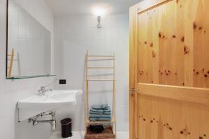 a white bathroom with a sink and a shower at Locanda delle Miniere in Ollomont +116 photos