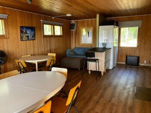 a living room with a couch and a table at Glamping by the sea in Äggrund