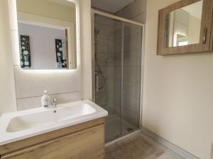 a bathroom with a sink and a shower at Brook Cottage in Coleraine +13 photos