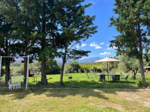 a park with a picnic table and an umbrella at SUNNY 3, Two-bedroom apartment with parking in Komotini