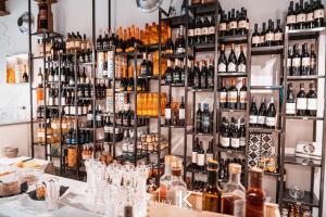 a room filled with lots of bottles of wine at B&B K Beach Lake Endine in Endine Gaiano