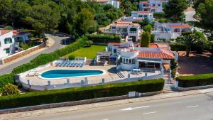 an aerial view of a house with a swimming pool at V206 Villa Isabel in Son Bou