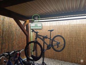 a bike parked in a garage with a sign at Hotel Rigel in Venice-Lido